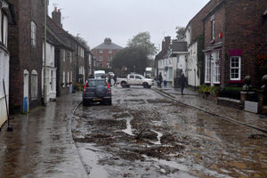 Thick mud remains on the High Street after the flooding