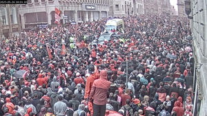 Paul Doyle's car (top centre) being driven through crowd on Water Street.