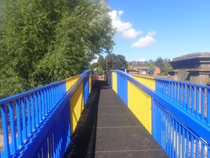 Supporting image for story: Refurbished footbridge installed in Shrewsbury - with eye-catching football-themed paint job