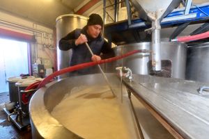 Brewer Jon Dale from Lichfield stirs the steamy mash at the brewery