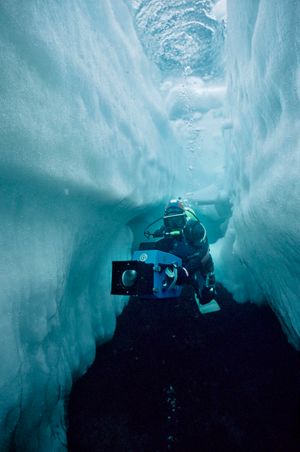 Doug Allan filming under sea ice in Lancaster Sound, Arctic Canada