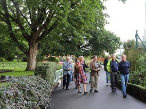 Supporting image for story: College staff and students explain their work in town's main park to Britain in Bloom judges