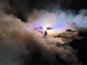 Supporting image for story: Firefighters battle throughout the night to tackle large blaze involving 400 tonnes of straw and manure