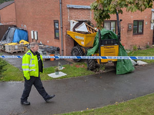 Supporting image for story: Stolen dumper truck house crash investigated as 'deliberate act' say Telford police - manhunt for driver under way