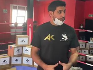 Supporting image for story: WATCH: Boxing champ Amir Khan delivers food packages to health workers and homeless in Black Country