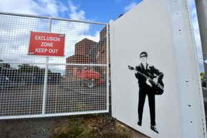 The painting of Roy Orbison is next to the entrance of the site