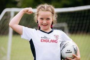 Millie Hickman, seven, proudly sporting her England kit