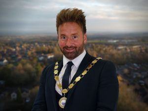 Supporting image for story: Fire-walking mayor 'honoured' to be re-elected in home town