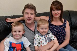 Simon Oldnall with partner Laura Irvine, 29, and their children Jake Oldnall, six, and Luke Oldnall, four.