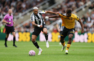 Joelinton of Newcastle United runs with the ball from Emmanuel Agbadou (Photo by Stu Forster/Getty Images)
