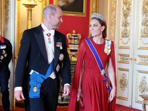 Supporting image for story: Kate dazzles in dark red silk at state banquet return