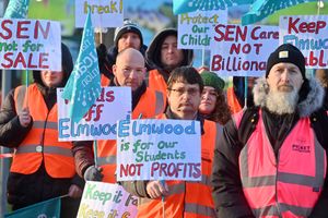 At Elmwood School, staff are on a picket line over the school planning to join the Matrix Academy Trust. Orange barriers and tape were deemed necessary by the school to stop staff standing on the grass.