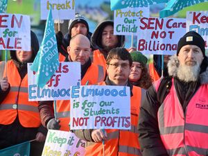 At Elmwood School, staff are on a picket line over the school planning to join the Matrix Academy Trust. Orange barriers and tape were deemed necessary by the school to stop staff standing on the grass.