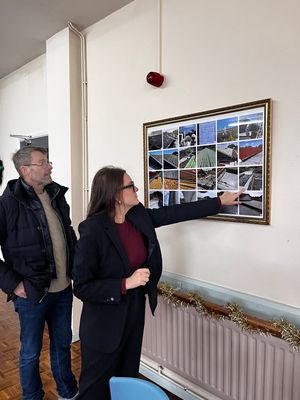 Mick Nixon of ARRC (Approved Rubber Roofing Contractors) with Leigh Ingham MP admiring photos showing the work that went on above the heads of those who use the centre.