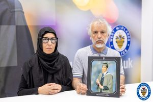 Pictured: Ali Durrani's parents with his graduation photo