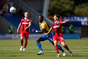 Dan Udoh of Shrewsbury Town and  Dan Ashead of Gillingham (AMA)