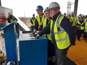 From left, group chairman Andrew Morgan, group chief executive Jo Williams and project manager Sean Delaney putting their hands in concrete for posterity at RSH topping out ceremony. Picture: LDRS
