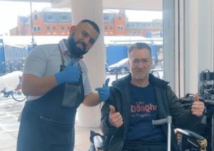 All finished, the man poses with a smile