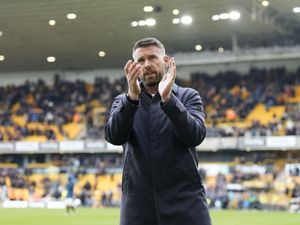 Rob Edwards claps visiting fans from a previous visit to Molineux