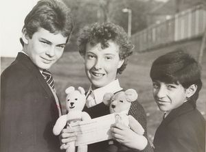 Pupils at Pensnett School took part in an afternoon of fundraising events, including a sponsored walk, sponsored spell, skating and computer games, to held leukaemia patients at Russells Hall Hospital in Dudley, and Norman Williams of Corbyns Close in Pensnett presented to pupils with two teddy bear mascots as a thank you. The photograph shows Stephen Lewis, Hardeep Bidi and Maxine Bagley with the bears in November 1986.