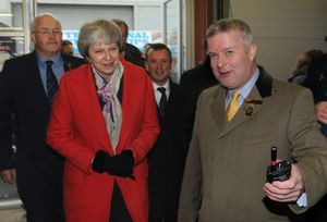 Theresa May is welcomed into the cattle judging pavilion by Brecon and Radnor MP Chris Davies