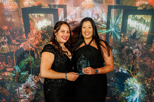 Gabriel Goldberg receives her award from Corinne Mo.