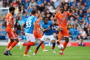 Jamal Lowe of Portsmouth and Omar Beckles of Shrewsbury Town. (AMA)