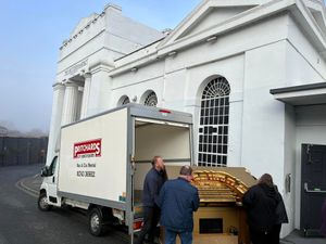 The console leaves the Buttermarket on a cold, foggy day.