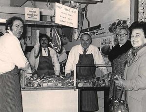 David, left, with his father Alfred, third from right