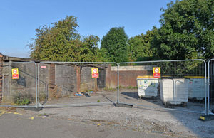 Carol Faulkner shows the bins at derelict garages in New Invention Square, Lichfield Road, Willenhall