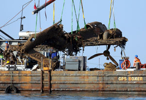 Lifting equipment raises the remains of the bomber from the English Channel. Photo: Gareth Fuller/PA Wire