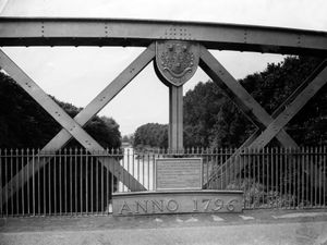 Buildwas Bridge in 1958. The caption reads: 'This structure spanning the River Severn at Ironbridge is known in the district as the 'Wenlock Bridge.' It was erected in 1905-1906 to replace Telford's first cast iron bridge, built in 1796. The underlying casting is a portion of the old bridge.'