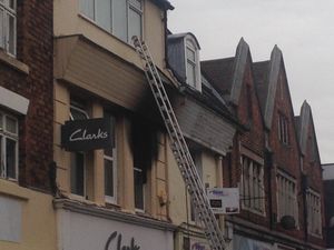Blackened walls show damage caused after the fire