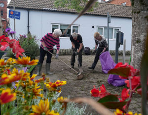 Some of the volunteers busy clearing up the streets