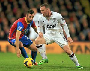 Golden boys – Wayne Rooney, right, and Joe Ledley in action