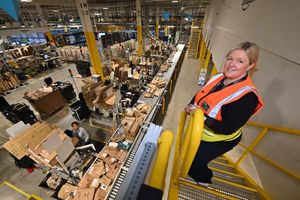 Lisa Swan (general manager) inside the Amazon fulfilment centre at Sutton Coldfied - overlooking the packing stations 