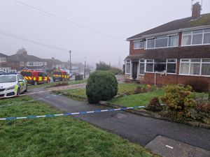 Police cordon around a house following a fire on Wendover Road in Wolverhampton