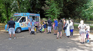 People queue for an ice cream at Walsall Arboretum