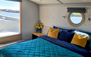 Dragonfly's luxurious bedroom features views over the water...