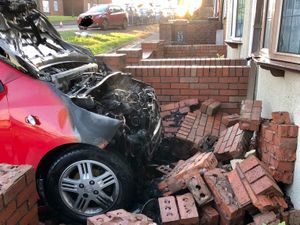 Supporting image for story: Car crashes into garden wall before bursting into flames in Coseley