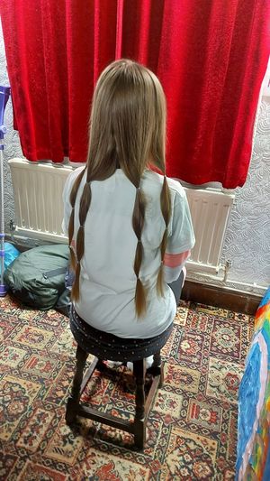 Maisie's long hair ready to cut