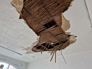The ceiling is covered in large holes