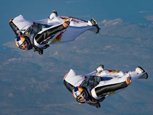 Supporting image for story: Watch daredevil wingsuit flyers land inside a moving plane in mid-air