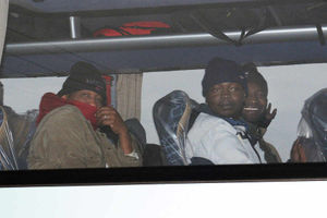 A coach carrying migrants leaves the Jungle today