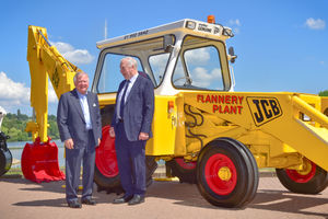 JCB Chairman Anthony Bamford and Pat Flannery Snr pictured by Flannery Plant Hire’s original 1972 JCB 3C backhoe loader, which helped establish the business