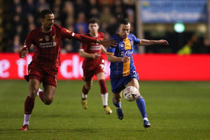 Joel Matip of Liverpool and Shaun Whalley of Shrewsbury Town (AMA)