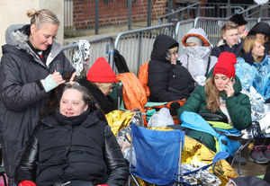 Dozens of people were wrapped in blankets and warm clothing waiting for the show to begin