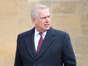 The Duke of York, walking outside wearing coat