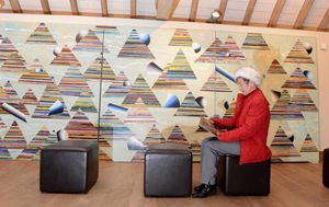 Margaret Smith in front of one of the works