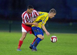 Kristian Green tries to find a way around Danny Fletcher